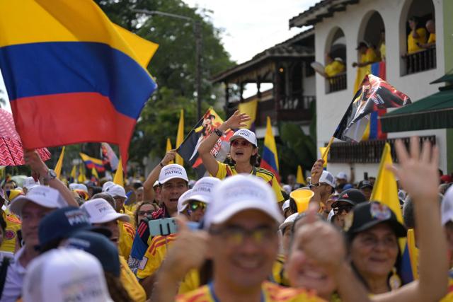 Supporters of Colombia's presidential candidate Abelardo de la Espriella of the Salvadores de la Patria movement attend his closing campaign rally in Buga, Valle del Cauca department, Colombia on June 14, 2026. Colombia will hold the runoff presidential election on June 21. (Photo by JOAQUIN SARMIENTO / AFP)