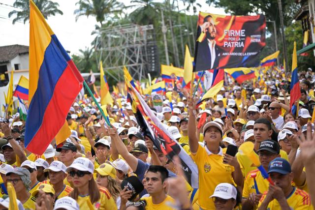 Supporters of Colombia's presidential candidate Abelardo de la Espriella of the Salvadores de la Patria movement attend his closing campaign rally in Buga, Valle del Cauca department, Colombia on June 14, 2026. Colombia will hold the runoff presidential election on June 21. (Photo by JOAQUIN SARMIENTO / AFP)