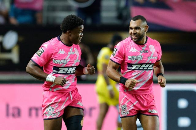 Stade Français' English center Joe Marchant (R) celebrates with Stade Français' Spanish winger Samuel Ezeala (L) after scoring a try during the French Top14 rugby union play-off match between Stade Francais Paris and Stade Rochelais (La Rochelle) at the Jean-Bouin Stadium in Paris on June 14, 2026. (Photo by GEOFFROY VAN DER HASSELT / AFP)
