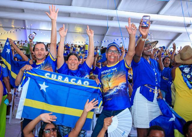 Supporters of Curacao cheer for their team as they watch the transmission of the FIFA World Cup match Germany vs Curacao in Willemstad, Curacao, on June 14, 2026. (Photo by Pong Pong / AFP)