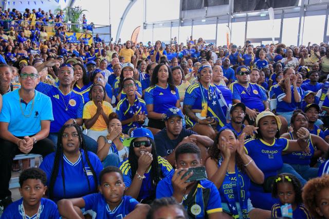 Supporters of Curacao cheer for their team as they watch the transmission of the FIFA World Cup match Germany vs Curacao in Willemstad, Curacao, on June 14, 2026. (Photo by Pong Pong / AFP)