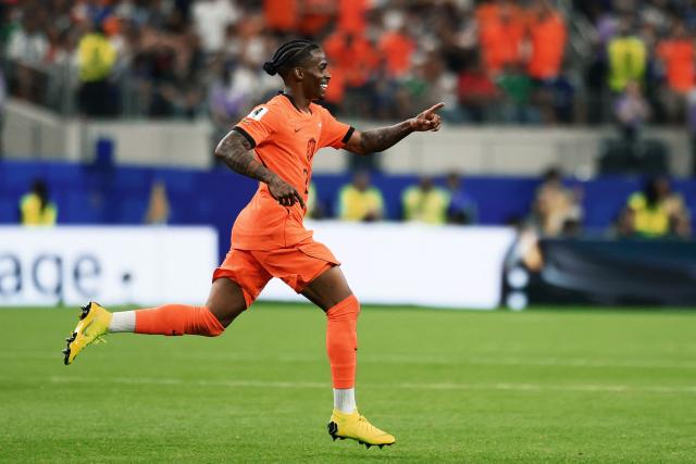 Netherlands' forward #24 Crysencio Summerville celebrates after scoring his team's second goal during the 2026 World Cup Group F football match between the Netherlands and Japan at the Dallas Stadium in Arlington on June 14, 2026.  (Photo by Aric Becker / AFP)