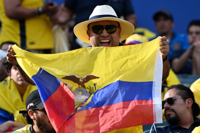 An Ecuadorian fan shows a national flag cheering for his team ahead of the 2026 World Cup Group E football match between Ivory Coast and Ecuador at the Philadelphia Stadium in Philadelphia on June 14, 2026.  (Photo by MAURO PIMENTEL / AFP)