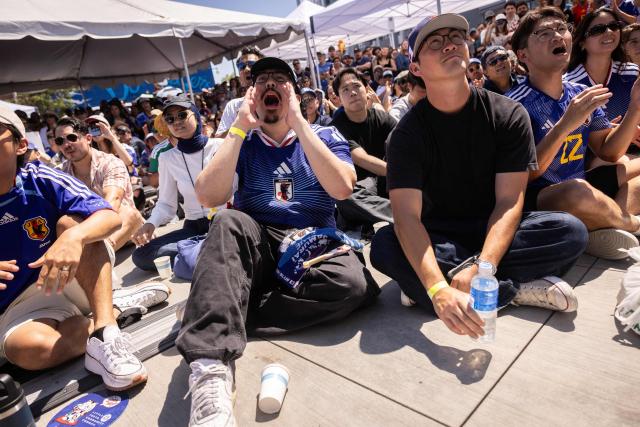 Supporters of Japan react during the second half of the match of the 2026 World Cup football tournament between Japan and the Netherlands, at a watch party in the Little Tokyo neighborhood of Los Angeles, California, on June 14, 2026. (Photo by ETIENNE LAURENT / AFP)