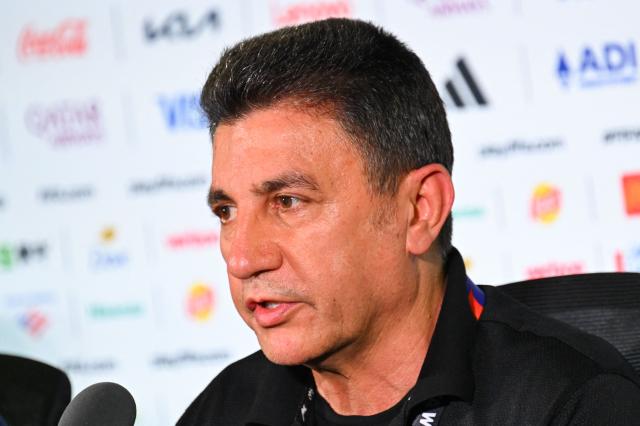 Iran's head coach Amir Ghalenoei (R) gives a press conference at Los Angeles Stadium in Inglewood on June 14, 2026, on the eve of the 2026 World Cup football match between Iran and New Zealand. (Photo by Patrick T. FALLON / AFP)