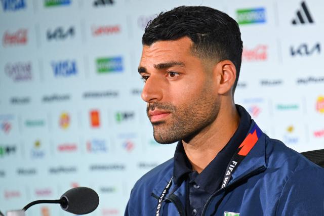 Iran's forward #09 Mehdi Taremi gives a press conference at Los Angeles Stadium in Inglewood on June 14, 2026, on the eve of the 2026 World Cup football match between Iran and New Zealand. (Photo by Patrick T. FALLON / AFP)