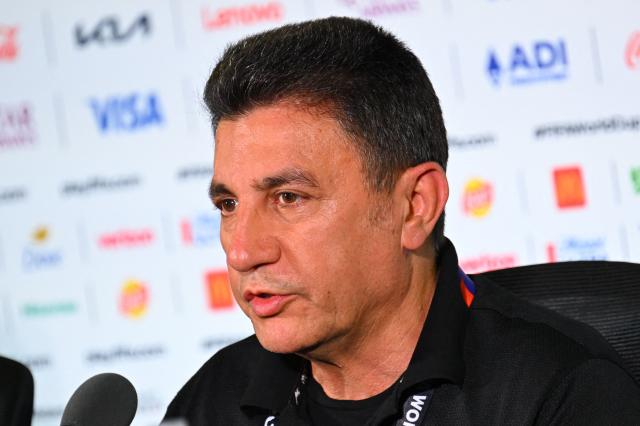Iran's head coach Amir Ghalenoei (R) gives a press conference at Los Angeles Stadium in Inglewood on June 14, 2026, on the eve of the 2026 World Cup football match between Iran and New Zealand. (Photo by Patrick T. FALLON / AFP)