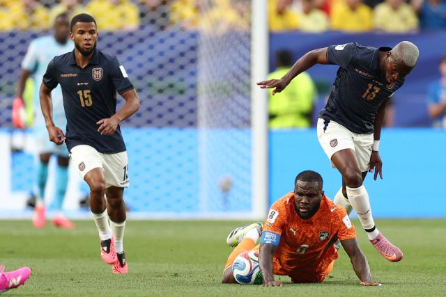 Ivory Coast's midfielder #08 Franck Kessie (C) falls on the ground past Ecuador's midfielder #15 Pedro Vite and forward #13 Enner Valencia during the 2026 World Cup Group E football match between Ivory Coast and Ecuador at the Philadelphia Stadium in Philadelphia on June 14, 2026.  (Photo by CHARLY TRIBALLEAU / AFP)