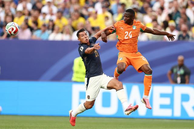 Ecuador's midfielder #21 Alan Franco and Ivory Coast's forward #24 Bazoumana Toure fight for the ball during the 2026 World Cup Group E football match between Ivory Coast and Ecuador at the Philadelphia Stadium in Philadelphia on June 14, 2026.  (Photo by CHARLY TRIBALLEAU / AFP)
