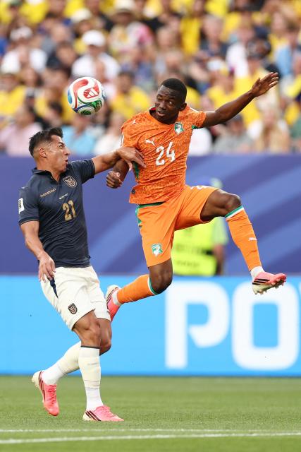 Ecuador's midfielder #21 Alan Franco and Ivory Coast's forward #24 Bazoumana Toure fight for the ball during the 2026 World Cup Group E football match between Ivory Coast and Ecuador at the Philadelphia Stadium in Philadelphia on June 14, 2026.  (Photo by CHARLY TRIBALLEAU / AFP)