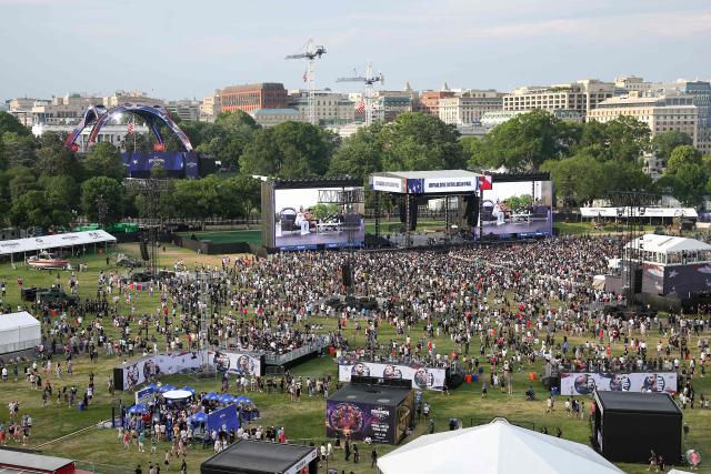 Fans attend the UFC Freedom 250 Fan Fest on The Ellipse ahead of the UFC Freedom 250 fight on the South Lawn of the White House on June 14, 2026 in Washington, DC. (Photo by Kevin Dietsch / POOL / AFP)