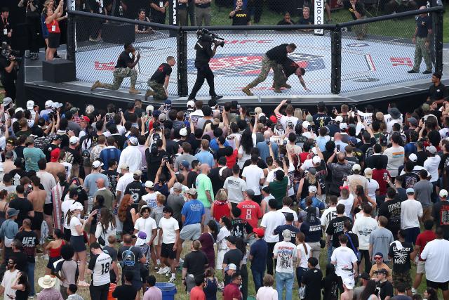 US Army soldiers hold a grappling demonstration during the UFC Freedom 250 Fan Fest on The Ellipse ahead of the UFC Freedom 250 fight on the South Lawn of the White House on June 14, 2026 in Washington, DC. (Photo by Kevin Dietsch / POOL / AFP)