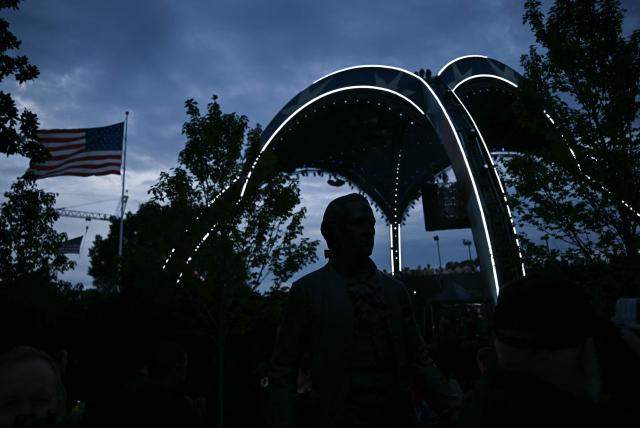 A silhouette of an Alexander Hamilton statue is seen ahead of the “UFC Freedom 250” mixed martial arts event on the South Lawn of the White House in Washington, DC, on June 14, 2026. (Photo by Brendan SMIALOWSKI / AFP)