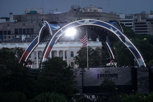WASHINGTON, DC - JUNE 14: The Claw and stadium seating risers for the UFC Freedom 250 fight are seen on the South Lawn of the White House on June 14, 2026 in Washington, DC. (Photo by Kevin Dietsch / POOL / AFP)