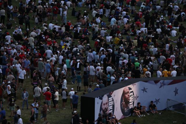 Fans gather for the "UFC Freedom 250" mixed martial arts event on The Ellipse, south of the White House in Washington, DC, June 14, 2026. (Photo by Kevin Dietsch / POOL / AFP)