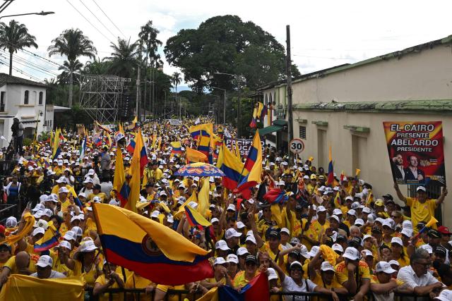 Supporters of Colombia's presidential candidate Abelardo de la Espriella of the Salvadores de la Patria movement attend his closing campaign rally in Buga, Valle del Cauca department, Colombia on June 14, 2026. Colombia will hold the runoff presidential election on June 21. (Photo by Joaquin SARMIENTO / AFP)