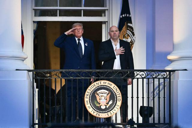 US President Donald Trump and UFC CEO Dana White stand for the national anthem during the "UFC Freedom 250" mixed martial arts event on the South Lawn of the White House in Washington, DC, June 14, 2026. (Photo by Kent NISHIMURA / AFP)