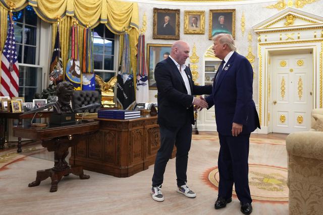 US President Donald Trump and UFC CEO Dana White shake hands before they walk out of the Oval Office of the White House, for the start of the "UFC Freedom 250" mixed martial arts event on the South Lawn of the White House in Washington, DC, June 14, 2026. (Photo by Al Drago / POOL / AFP)