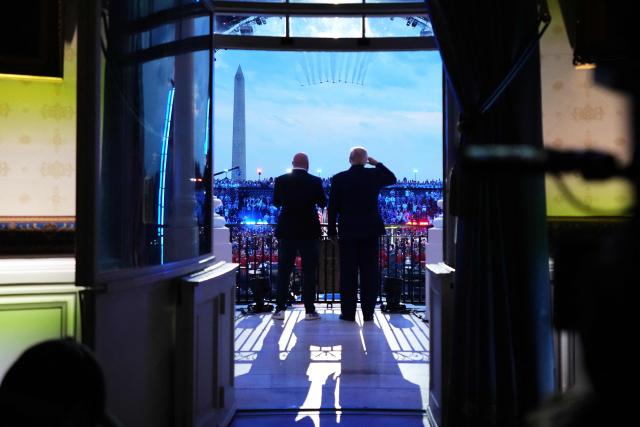 US President Donald Trump and UFC president and CEO Dana White watch the US Air Force Thunderbirds and US Navy Blue Angels perform a fly over the White House during the UFC Freedom 250 fights on the South Lawn of the White House, in Washington, DC, on June 14, 2026. (Photo by Jacquelyn Martin / POOL / AFP)