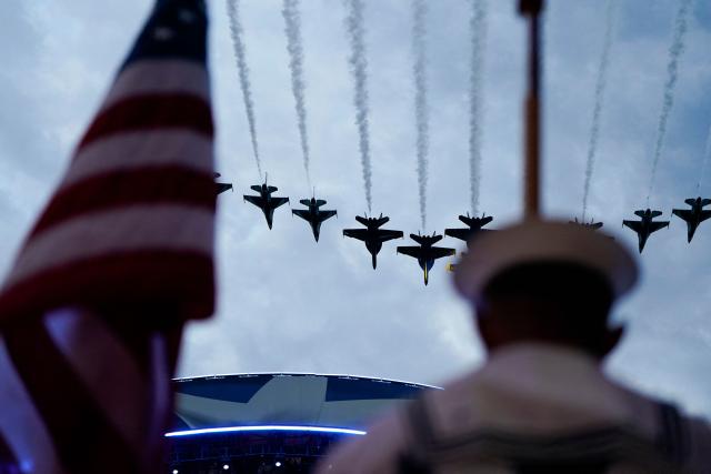 US Air Force Thunderbirds F-16 Fighting Falcons and US Navy Blue Angels perform a flyover during the "UFC Freedom 250" mixed martial arts event on the South Lawn of the White House in Washington, DC, June 14, 2026. (Photo by Elizabeth Frantz / POOL / AFP)