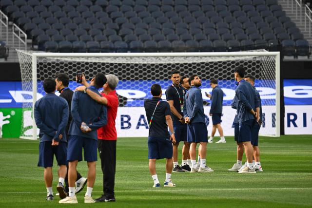 Iran’s players walk around the pitch after the press conference at Los Angeles Stadium in Inglewood on June 14, 2026, on the eve of the 2026 World Cup football match between Iran and New Zealand. (Photo by Patrick T. FALLON / AFP)