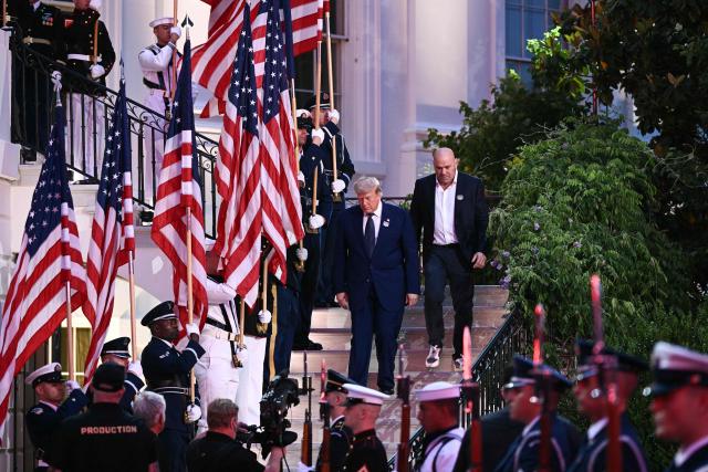 US President Donald Trump and President and CEO of Ultimate Fighting Championship Dana White arrive for the "UFC Freedom 250" mixed martial arts event on the South Lawn of the White House in Washington, DC, June 14, 2026. (Photo by Brendan SMIALOWSKI / AFP)