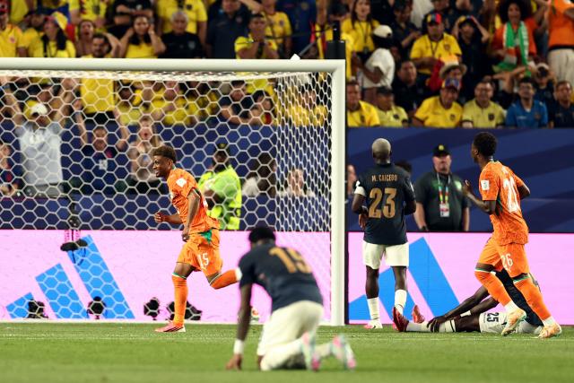 Ivory Coast's forward #15 Amad Diallo (L) celebrates scoring his team's first goal during the 2026 World Cup Group E football match between Ivory Coast and Ecuador at the Philadelphia Stadium in Philadelphia on June 14, 2026.  (Photo by CHARLY TRIBALLEAU / AFP)