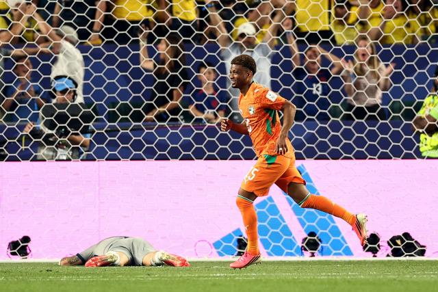 Ivory Coast's forward #15 Amad Diallo (R) celebrates scoring his team's first goal past Ecuador's goalkeeper #01 Hernan Galindez (L) during the 2026 World Cup Group E football match between Ivory Coast and Ecuador at the Philadelphia Stadium in Philadelphia on June 14, 2026.  (Photo by CHARLY TRIBALLEAU / AFP)