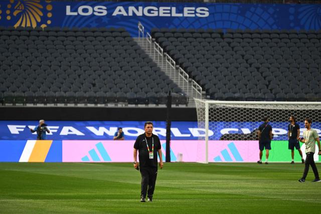 Iran's head coach Amir Ghalenoei walks around the pitch after the press conference at Los Angeles Stadium in Inglewood on June 14, 2026, on the eve of the 2026 World Cup football match between Iran and New Zealand. (Photo by Patrick T. FALLON / AFP)