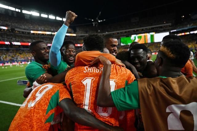 Ivory Coast's forward #15 Amad Diallo (unseen) celebrates with teammates after scoring his team's first goal during the 2026 World Cup Group E football match between Ivory Coast and Ecuador at the Philadelphia Stadium in Philadelphia on June 14, 2026.  (Photo by MAURO PIMENTEL / AFP)