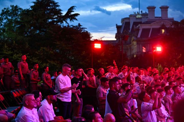 Spectators watch during the "UFC Freedom 250" mixed martial arts event on the South Lawn of the White House in Washington, DC, June 14, 2026. (Photo by Kent NISHIMURA / AFP)