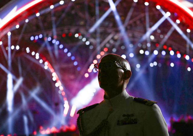 A member of the militray looks on during the "UFC Freedom 250" mixed martial arts event on the South Lawn of the White House in Washington, DC, June 14, 2026. (Photo by Brendan SMIALOWSKI / AFP)