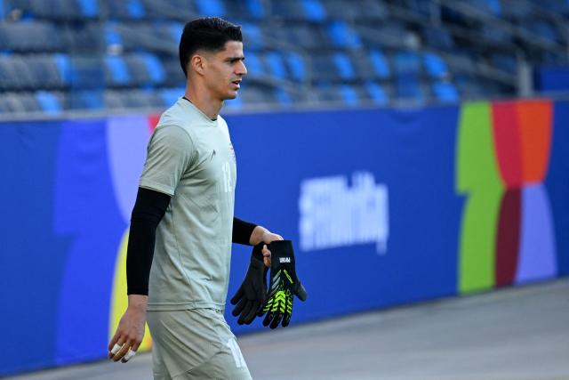 Iran's goalkeeper #12 Payam Niazmand takes part in a training session at Carson Sports Park in Carson, California on June 14, 2026, on the eve of the 2026 World Cup football match between Iran and New Zealand.  (Photo by Patrick T. Fallon / AFP)