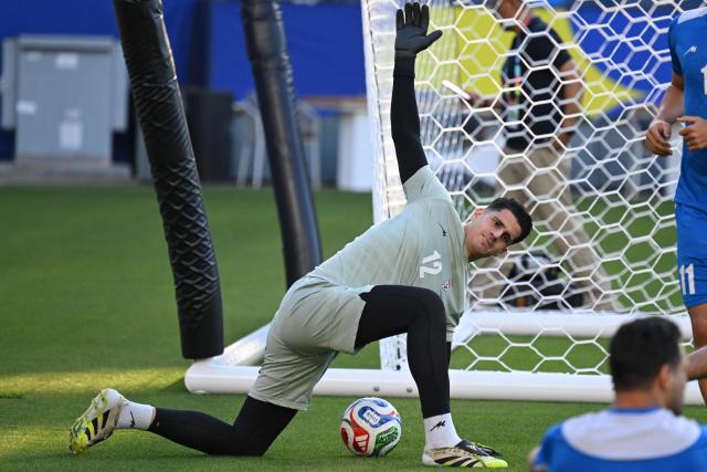 Iran's goalkeeper #12 Payam Niazmand takes part in a training session at Carson Sports Park in Carson, California on June 14, 2026, on the eve of the 2026 World Cup football match between Iran and New Zealand.  (Photo by Patrick T. Fallon / AFP)