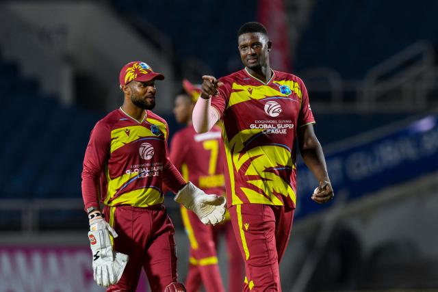 Shai Hope (L) and Jason Holder (R) of West Indies are seen during the third Twenty20 (T20) international cricket match between West Indies and Sri Lanka at Sabina Park in Kingston, Jamaica, on June 14, 2026. (Photo by Randy Brooks / AFP)