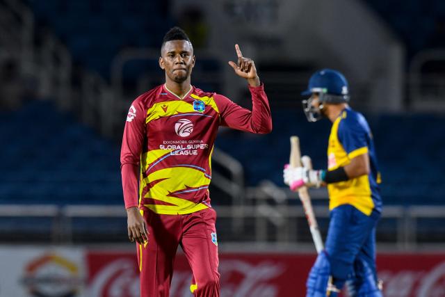 Akeal Hosein of West Indies celebrates the dismissal of Kamindu Mendis of Sri Lanka during the third Twenty20 (T20) international cricket match between West Indies and Sri Lanka at Sabina Park in Kingston, Jamaica, on June 14, 2026. (Photo by Randy Brooks / AFP)