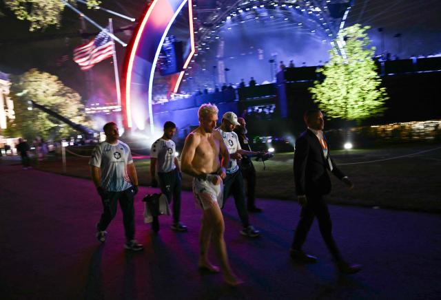 Mixed martial artist US's Kyle Daukaus walks away after losing by Technical Knockout to US's Bo Nickal in their middleweight bout during the "UFC Freedom 250" mixed martial arts event on the South Lawn of the White House in Washington, DC, June 14, 2026. (Photo by Brendan SMIALOWSKI / AFP)