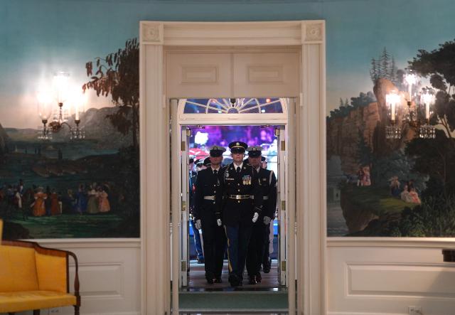 US military honor guard walks back into the Diplomatic Reception Room of the White House during UFC Freedom 250 on the South Lawn of the White House, in Washington, DC on June 14, 2026. (Photo by Al Drago / POOL / AFP)