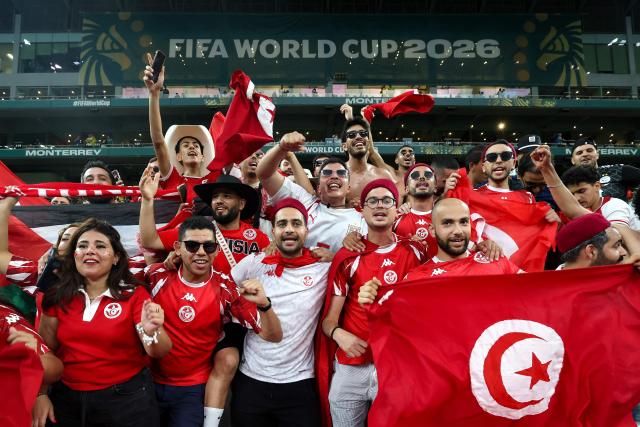 Tunisian's fans gesture ahead of the 2026 World Cup Group F football match between Sweden and Tunisia at the Monterrey Stadium in Guadalupe on June 14, 2026.  (Photo by Julio Cesar AGUILAR / AFP)