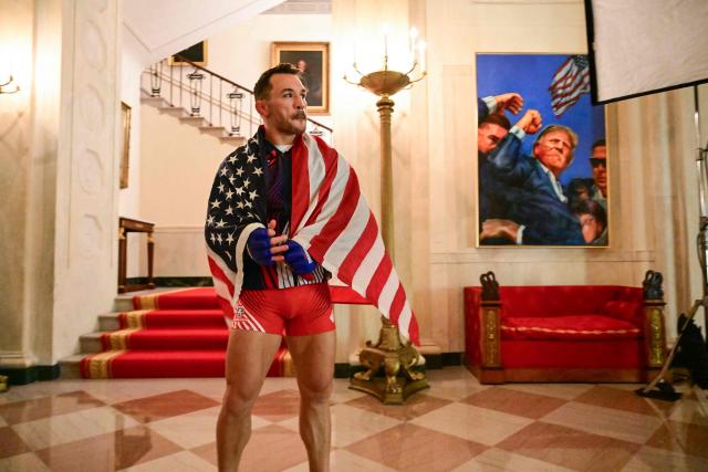 America's Michael Chandler waits in the Grand Foyer of the White House before his lightweight bout against Brazil's Mauricio Ruffy during the "UFC Freedom 250" mixed martial arts event on the South Lawn of the White House in Washington, DC, June 14, 2026. (Photo by SAUL LOEB / POOL / AFP)