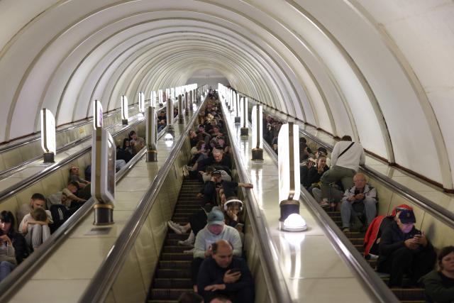 People shelter in a metro station during a Russian missile strike on the Ukrainian capital Kyiv on June 15, 2026, amid the Russian invasion in Ukraine. A major missile attack struck Kyiv early on June 15, an AFP reporter witnessed, with projectiles intercepted in the sky and glowing debris falling onto the city. Ukrainian officials including the city's mayor Vitali Klitschko reported on Telegram that strikes hit various districts. (Photo by Serhii Okunev / AFP)