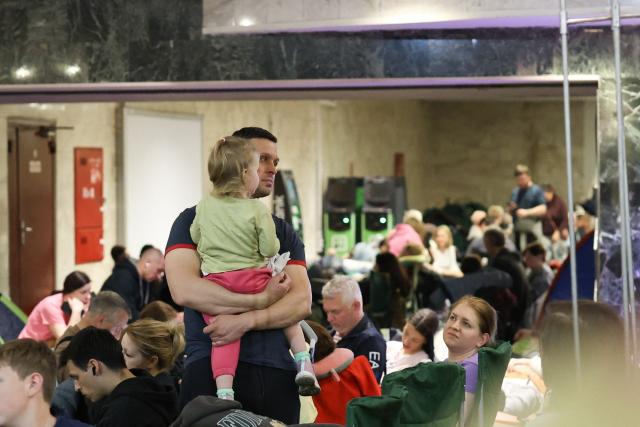 People shelter in a metro station during a Russian missile strike on the Ukrainian capital Kyiv on June 15, 2026, amid the Russian invasion in Ukraine. A major missile attack struck Kyiv early on June 15, an AFP reporter witnessed, with projectiles intercepted in the sky and glowing debris falling onto the city. Ukrainian officials including the city's mayor Vitali Klitschko reported on Telegram that strikes hit various districts. (Photo by Serhii Okunev / AFP)