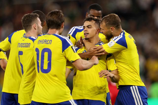 Sweden's midfielder #18 Yasin Ayari (2nd-R) celebrates with teammates scoring his team's first goal during the 2026 World Cup Group F football match between Sweden and Tunisia at the Monterrey Stadium in Guadalupe on June 14, 2026.  (Photo by Julio Cesar AGUILAR / AFP)