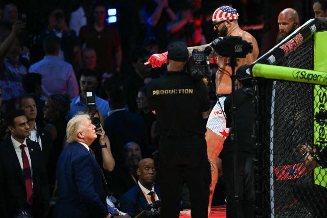 US President Donald Trump speaks with America's Josh Hokit during the "UFC Freedom 250" mixed martial arts event on the South Lawn of the White House in Washington, DC, June 14, 2026. (Photo by Kent NISHIMURA / AFP)