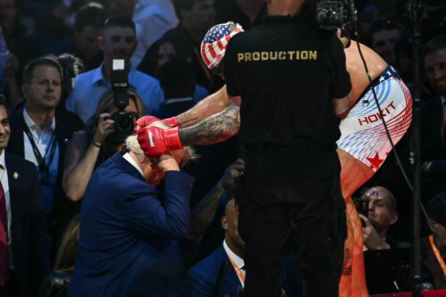 US President Donald Trump interacts with America's Josh Hokit during the "UFC Freedom 250" mixed martial arts event on the South Lawn of the White House in Washington, DC, June 14, 2026. (Photo by Kent NISHIMURA / AFP)
