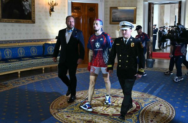 US's Sean O'Malley walks through the Blue Room of the White House ahead of his bantamweight fight against Canada's Aiemann Zahabi during the "UFC Freedom 250" mixed martial arts event in Washington, DC, June 14, 2026. (Photo by SAUL LOEB / POOL / AFP)