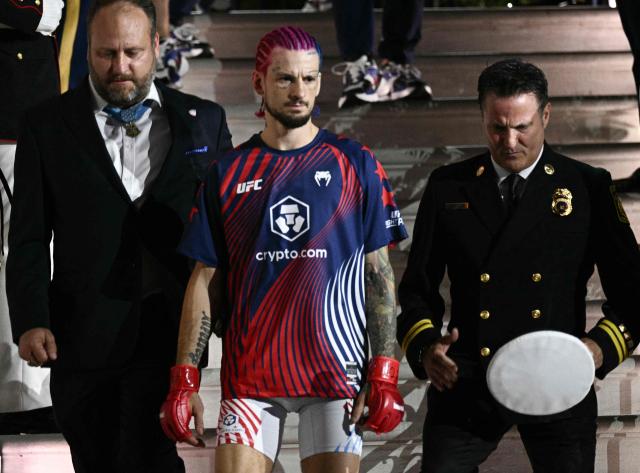 Mixed martial artist US's Sean O'Malley walks down the White House steps ahead of his bantamweight fight against Canada's Aiemann Zahabi during the "UFC Freedom 250" mixed martial arts event in Washington, DC, June 14, 2026. (Photo by Brendan SMIALOWSKI / AFP)