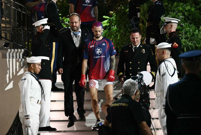 Mixed martial artist US's Sean O'Malley walks down the White House steps ahead of his bantamweight fight against Canada's Aiemann Zahabi during the "UFC Freedom 250" mixed martial arts event in Washington, DC, June 14, 2026. (Photo by Brendan SMIALOWSKI / AFP)
