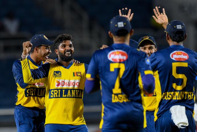 Dunith Wellalage (2L) of Sri Lanka celebrates the dismissal of Shimron Hetmyer of West Indies during the third Twenty20 (T20) international cricket match between West Indies and Sri Lanka at Sabina Park in Kingston, Jamaica, on June 14, 2026. (Photo by Randy Brooks / AFP)