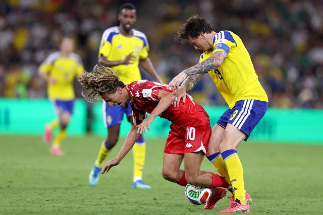 Tunisia's midfielder #10 Hannibal Mejbri is fouled by Sweden's defender #03 Victor Lindelof during the 2026 World Cup Group F football match between Sweden and Tunisia at the Monterrey Stadium in Guadalupe on June 14, 2026.  (Photo by Julio Cesar AGUILAR / AFP)
